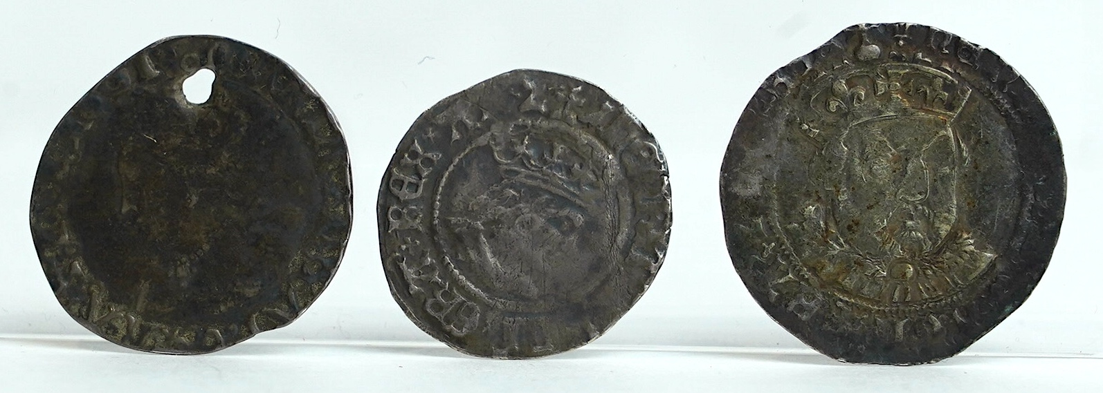 British Tudor hammered silver coins, a Henry VII (1485-1509) halfgroat, York mint, two keys below shield (S2262), fine, a Henry VIII (1509-47) groat, third coinage, c.1544–7, fine, and a Mary (1553-54) groat (S2492), hol